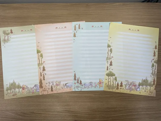 Lote com 4 papéis médios do Pooh